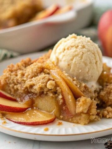 A freshly baked apple crisp in a rustic kitchen setting.