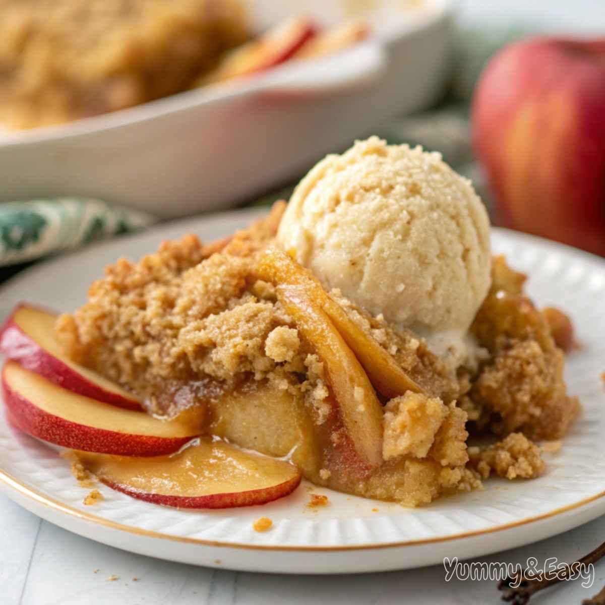 A freshly baked apple crisp in a rustic kitchen setting.