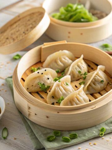 Fresh gluten-free dumplings in a bamboo steamer